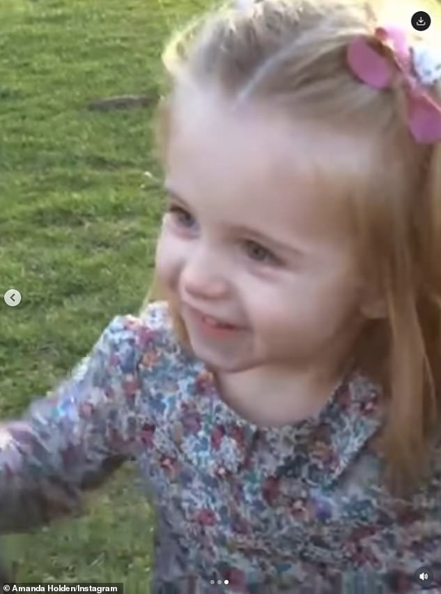 The TV personality added a heartwarming video to the post of a little Hollie running towards her mum and dad in the park and declaring: 'BASH!'