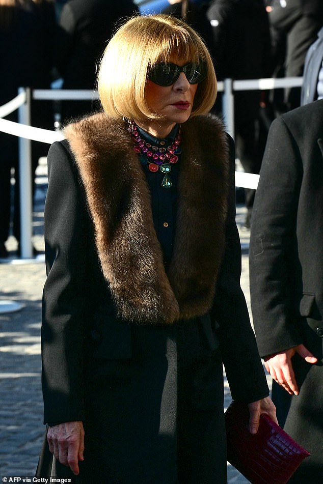 Anna Wintour, Global Chief Content Officer and Artistic Director for Condé Nast and Global Editorial Director for Vogue, shielded her eyes with her signature sunglasses