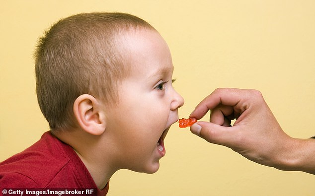 Vitamins for children often come in the form of jelly sweets with marvellous flavours such as strawberry and tutti-frutti (picture posed by model)