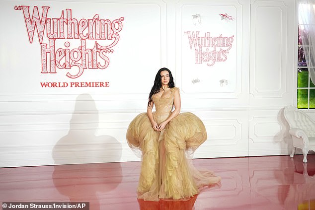 She wore her jet black hair down, letting it fall down her back in waves