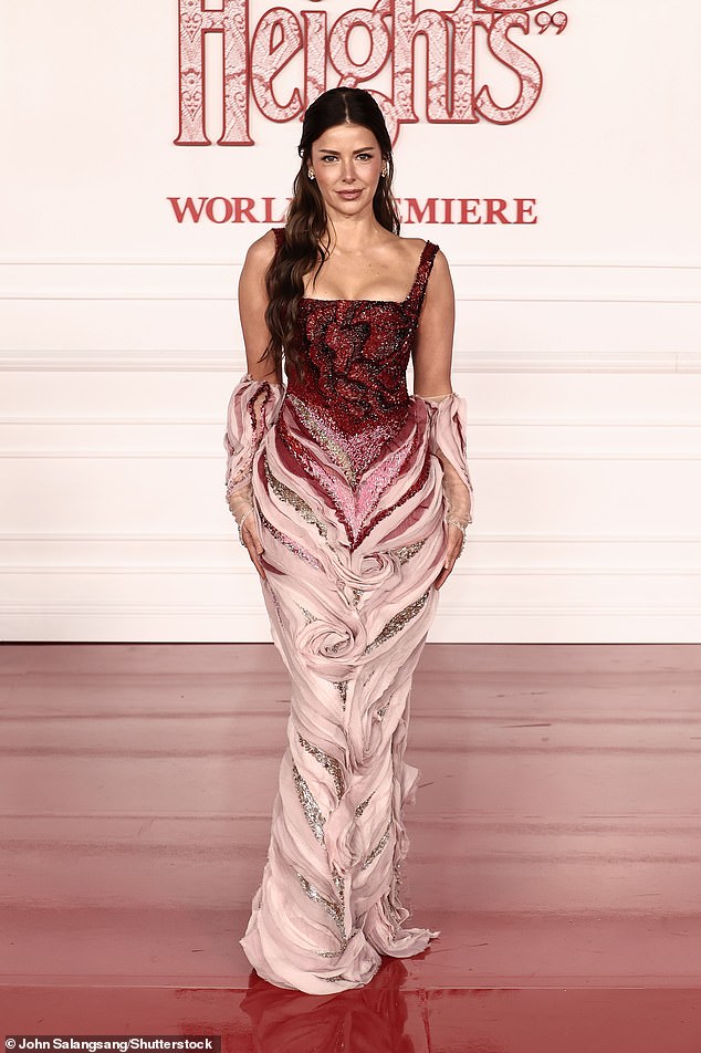 Love Island USA host Ariana Madix, 40, looked ultra radiant while posing for photos in a busty curve-enhancing gown featuring a bedazzled maroon corset