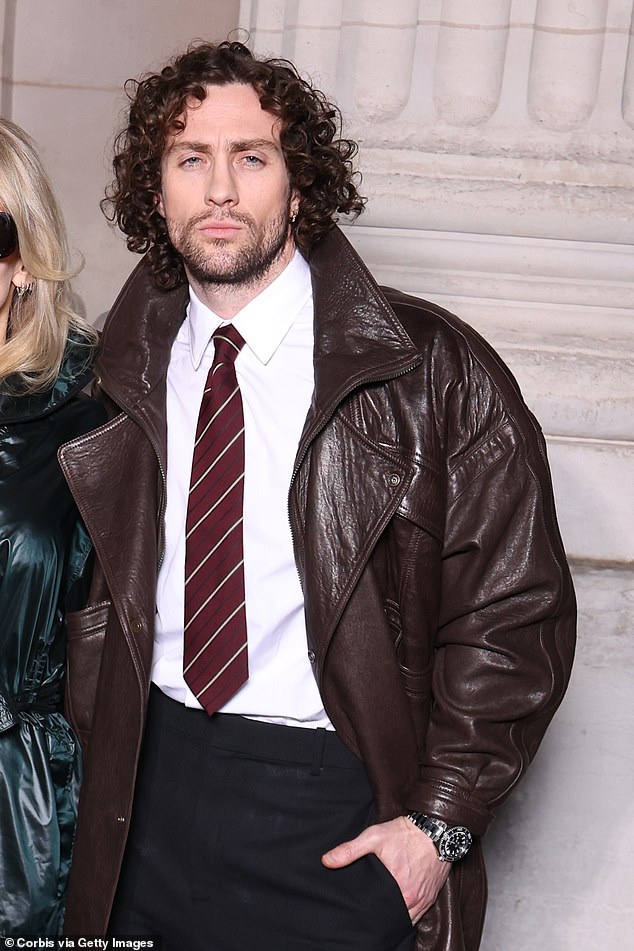 The British actor, 35, and his wife, Sam, 58, cut stylish figures as they made their way to the fashion event in the French capital