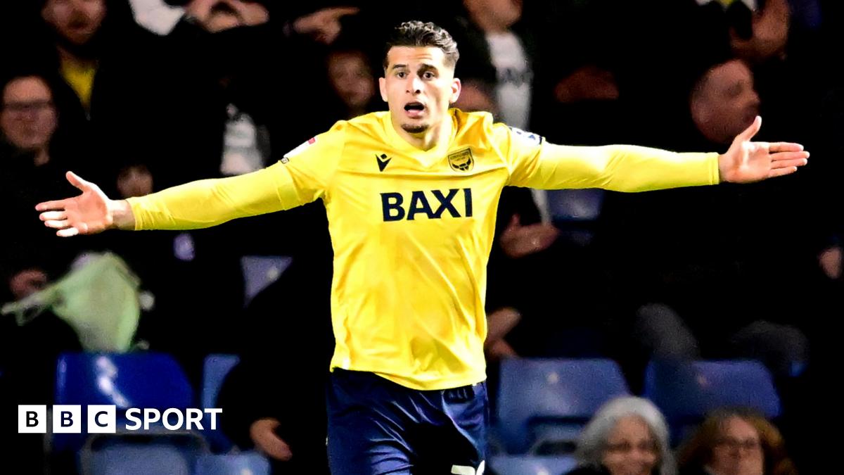 Ruben Rodrigues gestures with his arms out wide while playing for Oxford United