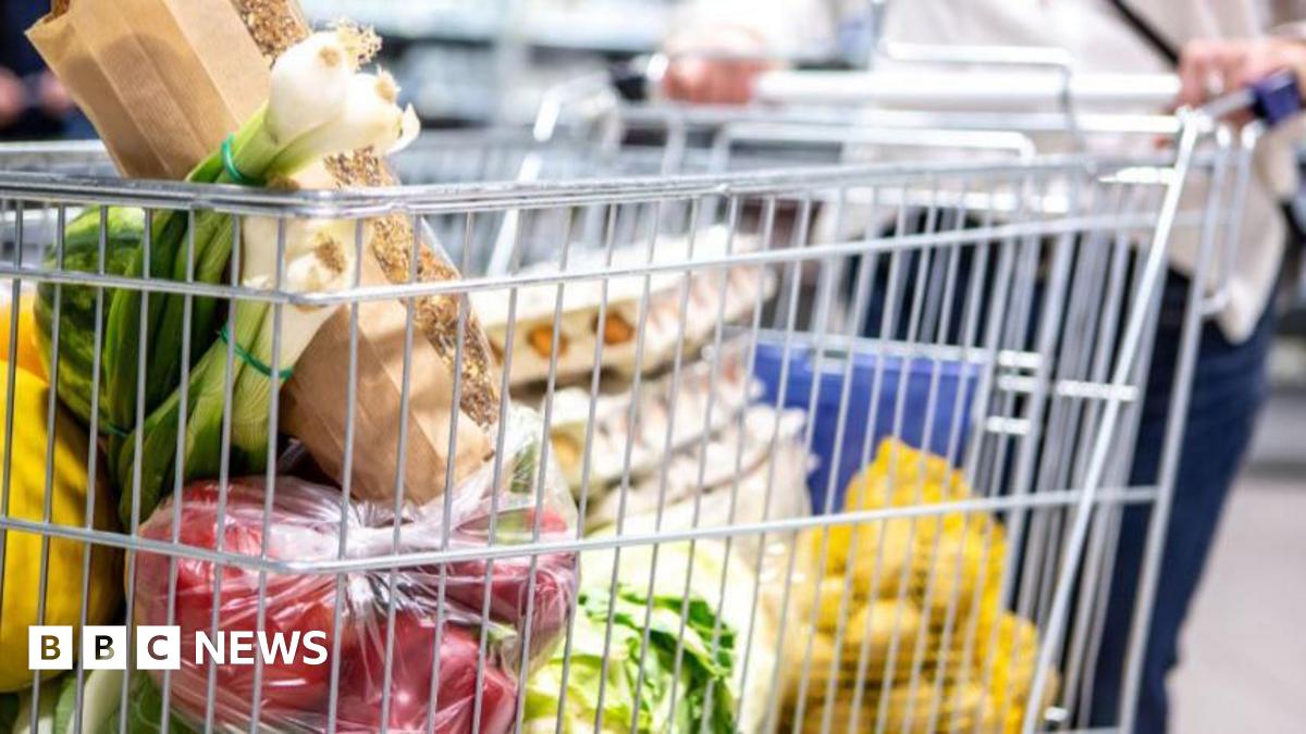 A pile of unpeeled orange carrots.