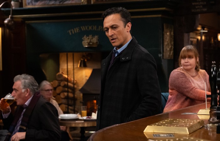 Jai looks frustrated stood at the bar of The Woolpack in Emmerdale