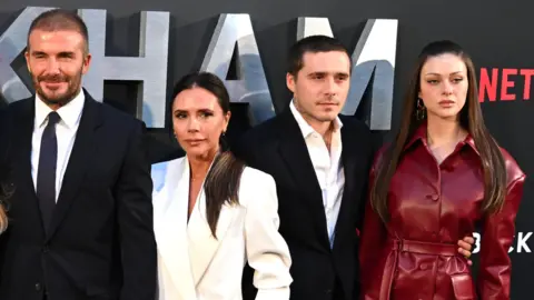 Getty Images (Left to right) David Beckham, Victoria Beckham, Brooklyn Beckham and Nicola Peltz attending the Netflix UK premiere of the Beckham documentary, in London in 2023