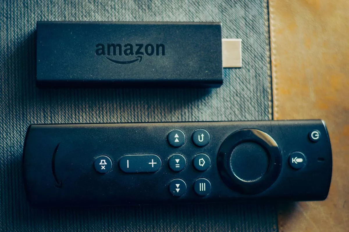 Amazon fire stick TV remote in hand