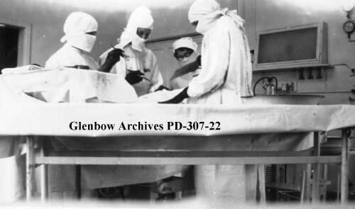 An operating room at the Calgary General Hospital School of Nursing (what remains of the building is now known as the "Rundle Ruins" in Calgary's southeast.) The photograph is from the album of Florence J. Cameron, a nursing student, and was entitled 'Calgary General Hospital, Class 1928 1931'. The image was annotated: 'The biggest operations are always performed when the supervisors are off duty.'