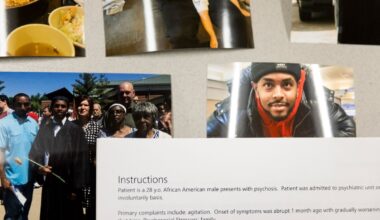 Several printed family photos and a hospital record on a table.