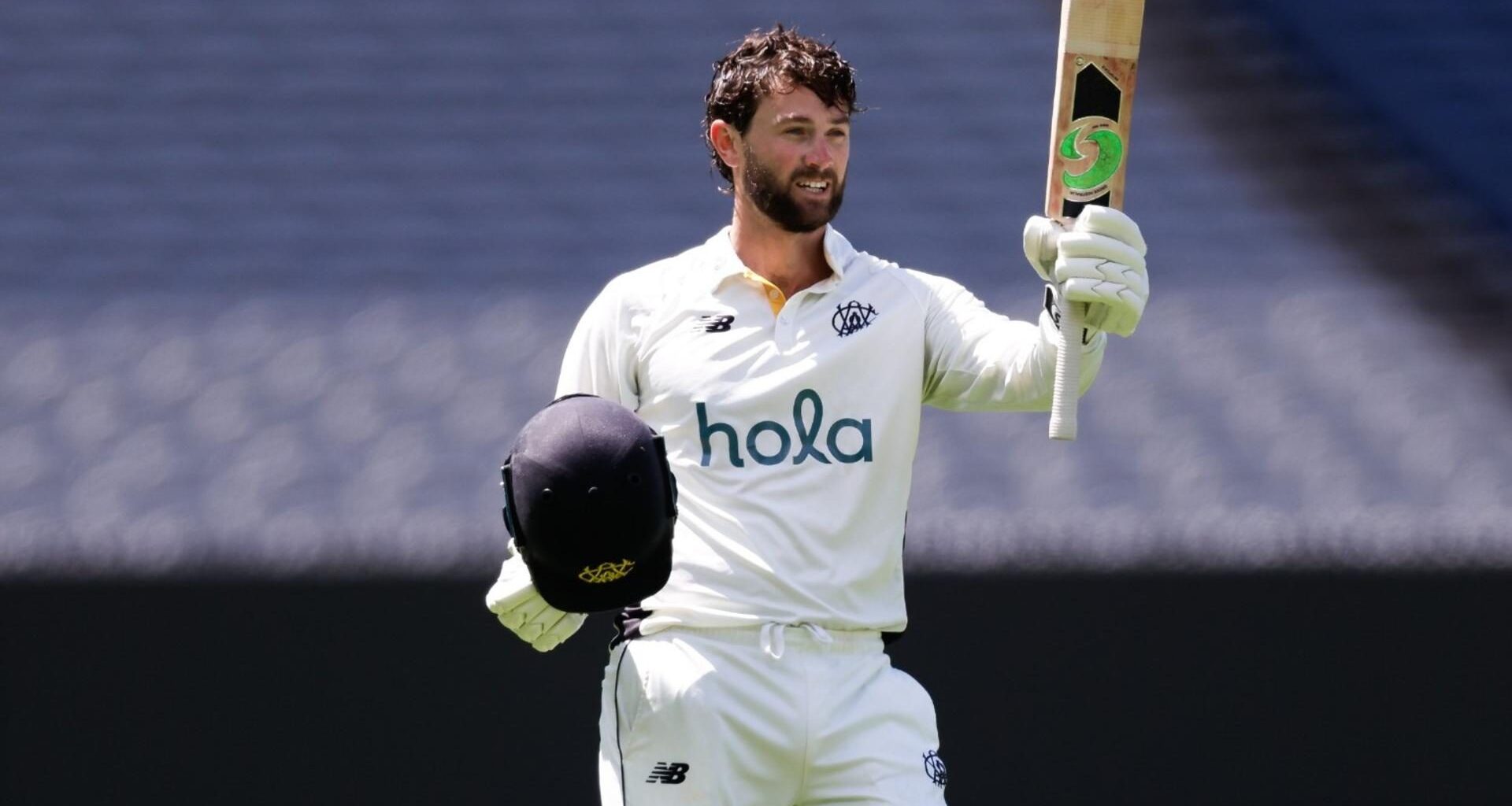 Sam Whiteman raises his bat to celebrate scoring a century in the Sheffield Shield