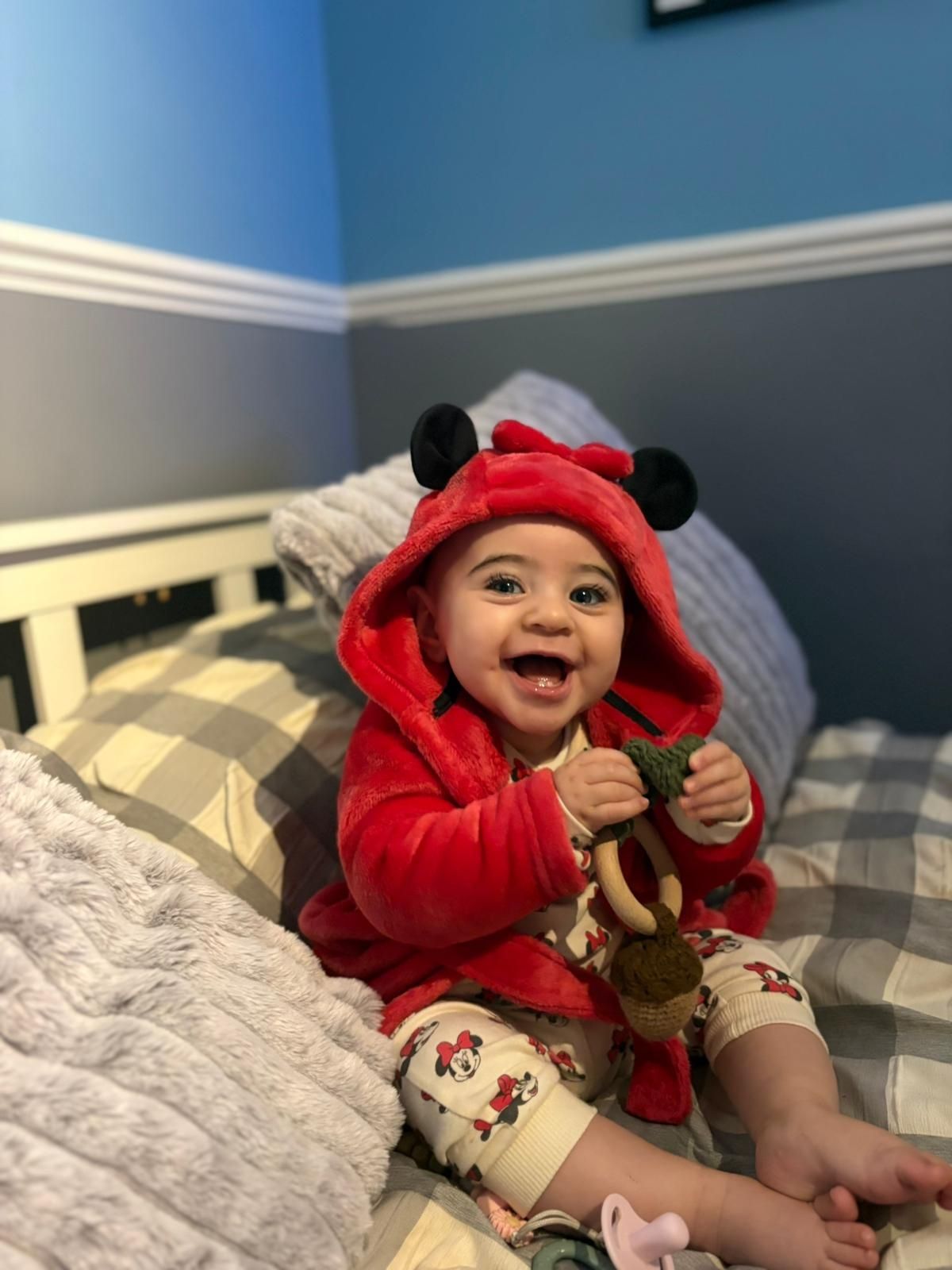 Hazel in a red hoody with mouse ears