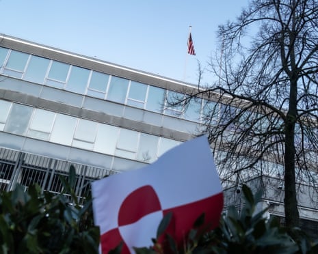 The US flag is on the roof of the US embassy, with the Greenlandic flag in the foreground during a demonstration titled '‘Greenland belongs to the Greenlanders'’ outside the US embassy in Copenhagen, Denmark.