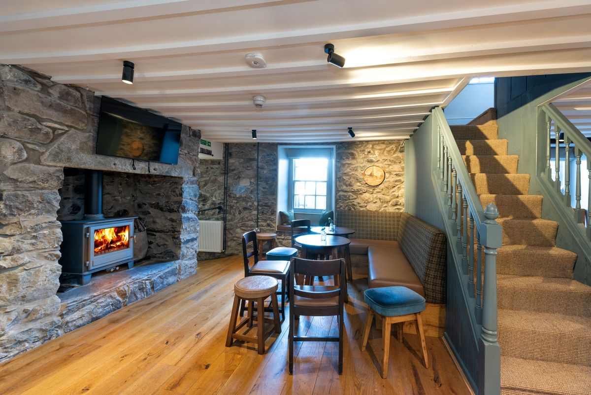 With a wall gone and a full renovation, the entrance, first floor staircase and one of the pub rooms is unrecognisable at The renovation, conversion and transformation of T'yn Llan commnity pub in Llandwrog, Gwynedd this is the new build extension with restaurant, catering kitchen, facilities and community room