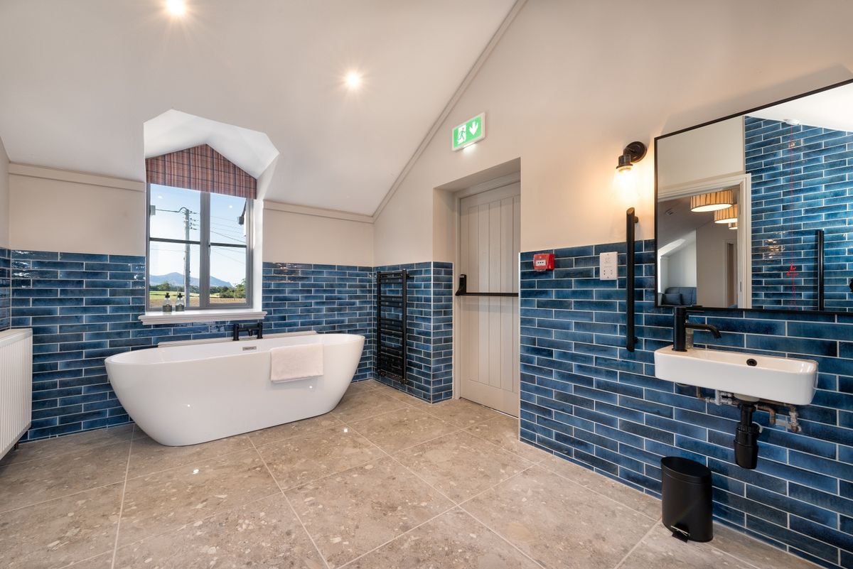 One of the pub's ensuite bathrooms at The renovation, conversion and transformation of T'yn Llan commnity pub in Llandwrog, Gwynedd this is the new build extension with restaurant, catering kitchen, facilities and community room -  this is inside the old pub after renovation