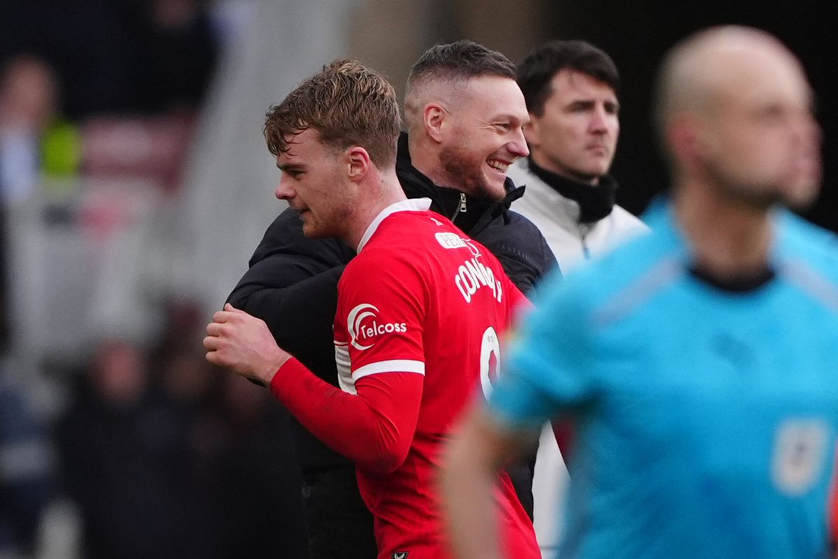 Middlesbrough's Tommy Conway (left) hugs boss Kim Hellberg after he is substituted