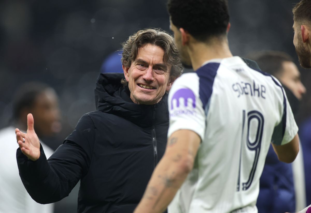 Thomas Frank celebrates with Dominic Solanke after the UEFA Champions League match between Eintracht Frankfurt and Tottenham Hotspur