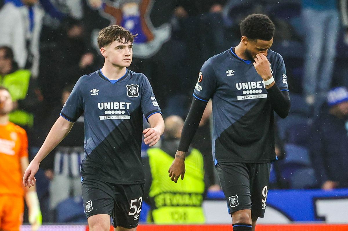 Rangers' Youssef Chermiti (R) and Findlay Curtis (L) looks dejected after Emmanuel Fernandez scores an own goal to make it 3-1 vs Porto