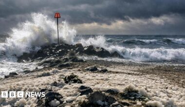 Highcliffe, Christchurch Dorset - beach with large waves crashing in