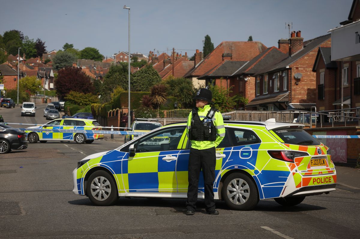 Police pictured at the scene in Westdale Lane East, Carlton, following the knife attack