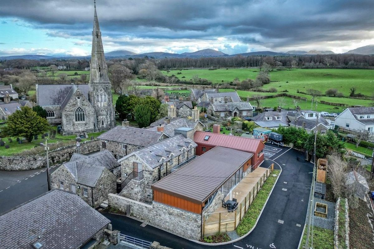 The renovation, conversion and transformation of T'yn Llan commnity pub in Llandwrog, Gwynedd this is the new build extension with restaurant, catering kitchen, facilities and community room - this is an aerial view