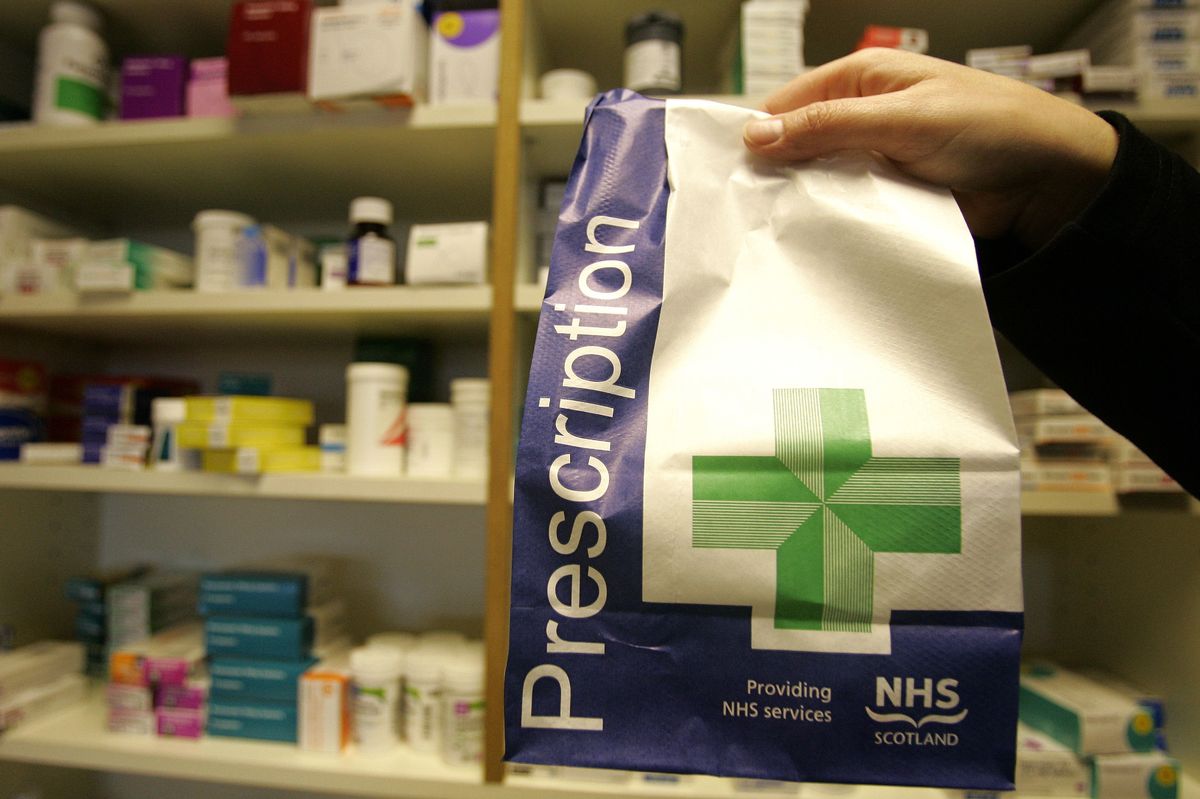 A prescription being picked up at a pharmacy