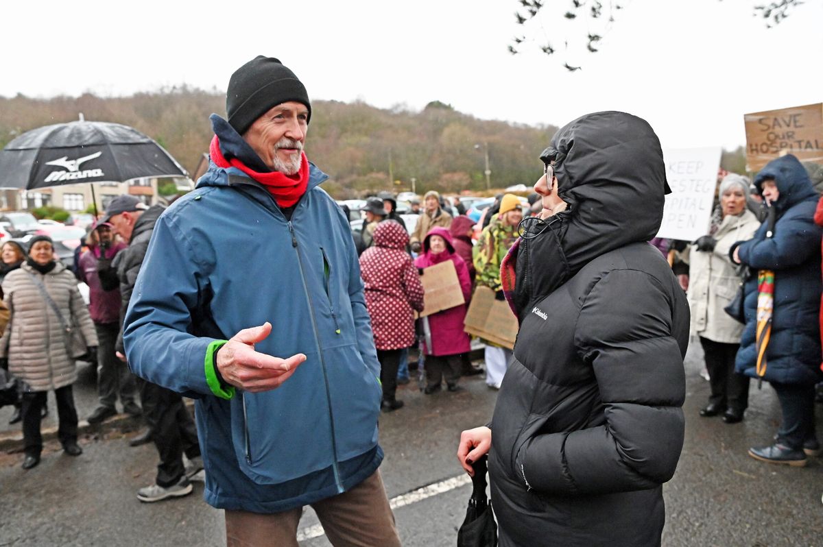 People protest the planned closure of a hospital
