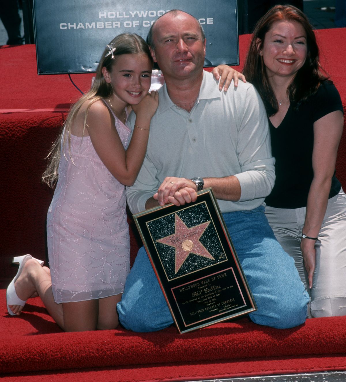 Musician Phil Collins and daughters Lily Collins and Joely Collins in 1999.