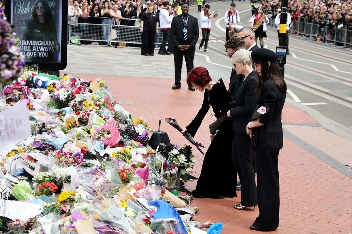 Ozzy Osbourne's family including Jack at the floral tributes on the day of his funeral last year.