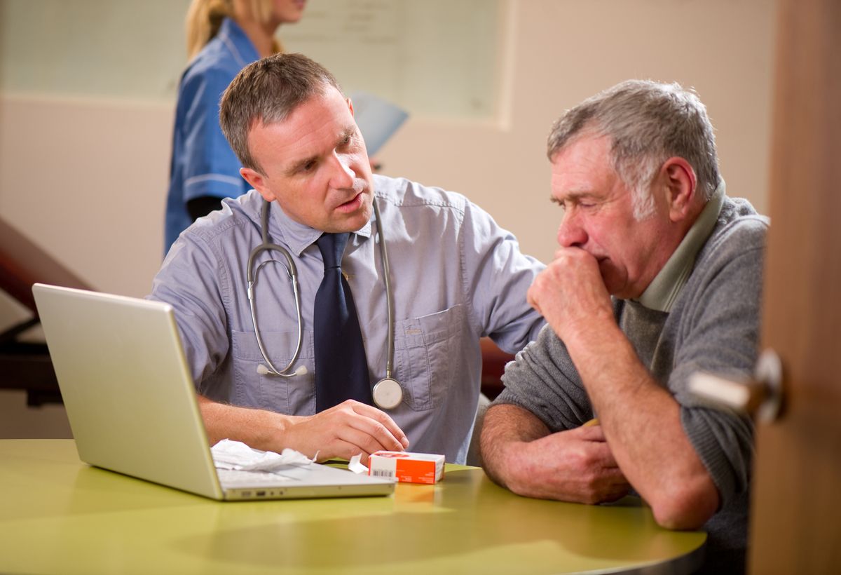doc checks senior male with bad cough .