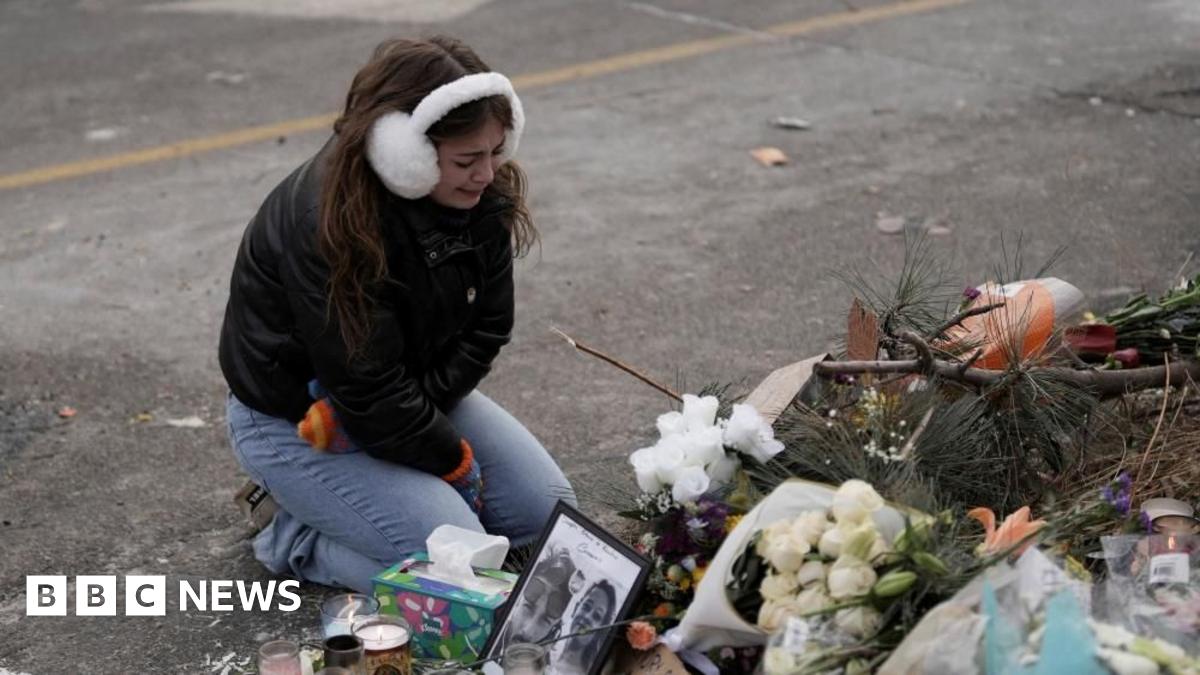 A local church provides hot coffee and hand warmers near a makeshift memorial for Alex Pretti in south Minneapolis, Minnesota