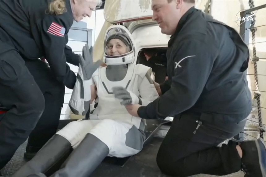 Suni Williams exits the Crew Dragon capsule after she and Butch Wilmore, and two other astronauts, splashed down off Florida's coast following a return from the International Space Station in March 2025.