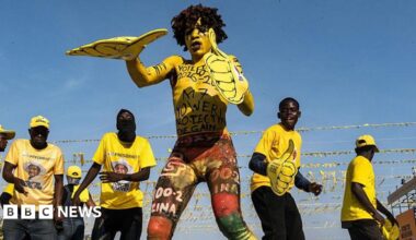 A woman sells bananas near campaign posters of Uganda's President and the leader of ruling National Resistance Movement (NRM) party, Yoweri Museveni, following the general elections in Kampala, Uganda January 17, 2026