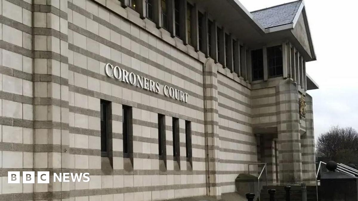 An image of the exterior of Doncaster Coroner's Court. It has stonework with horizontal stripes, and a crest above the entrance