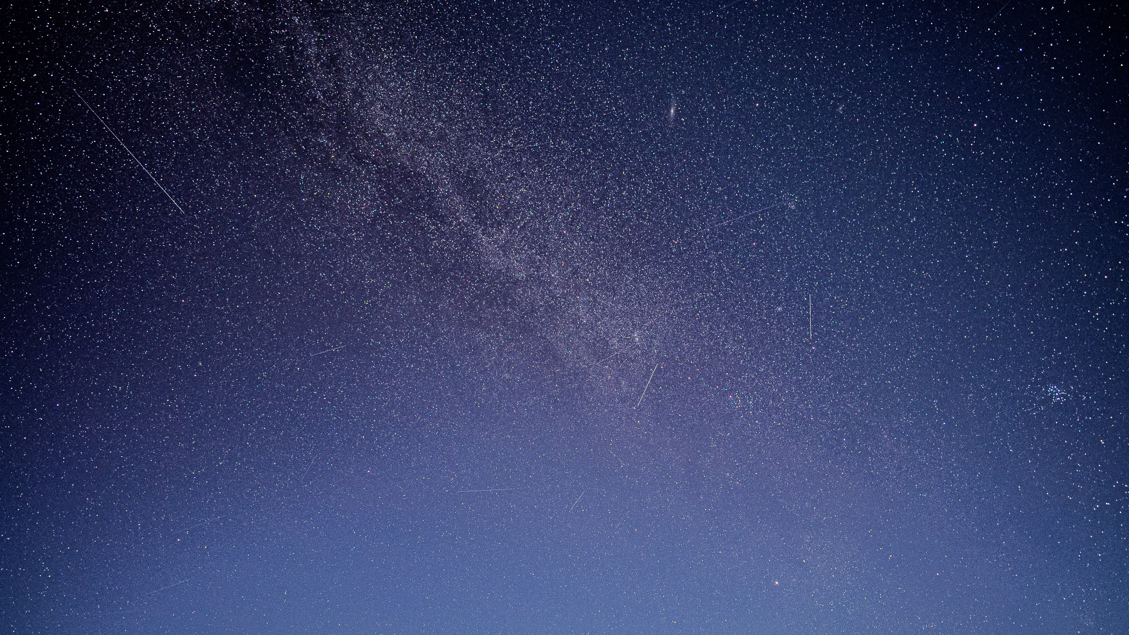 milky Way stretches through the center. upper middle is Andromeda and to the right is the Pleiades.