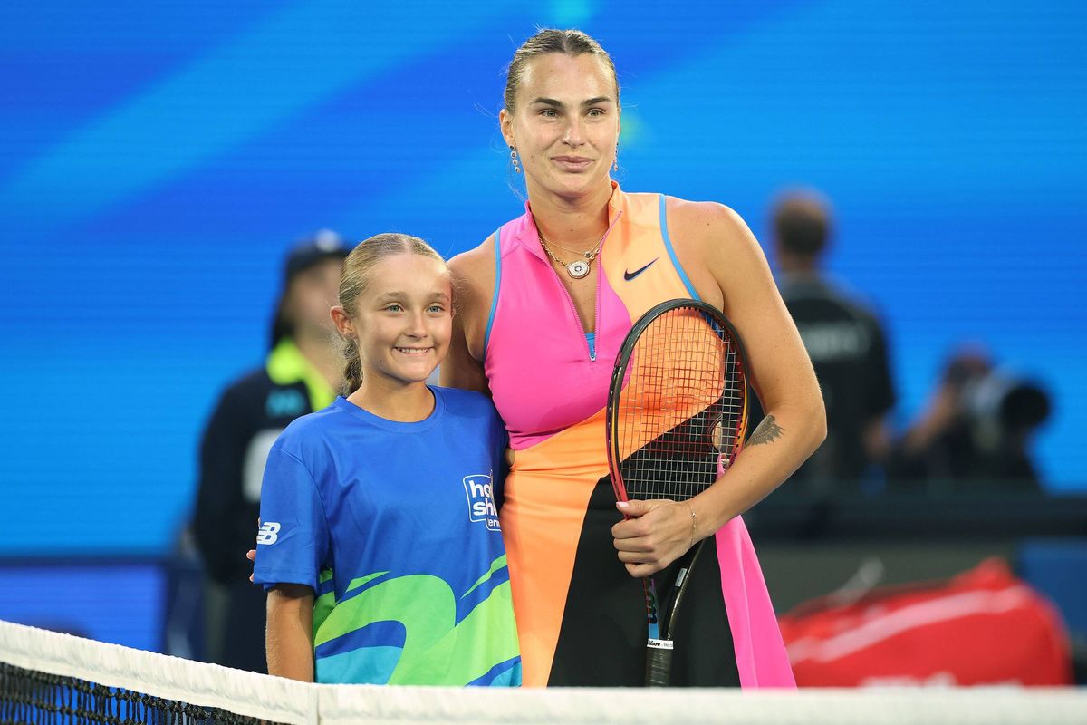 Ava Sultana stands with Aryna Sabalenka
