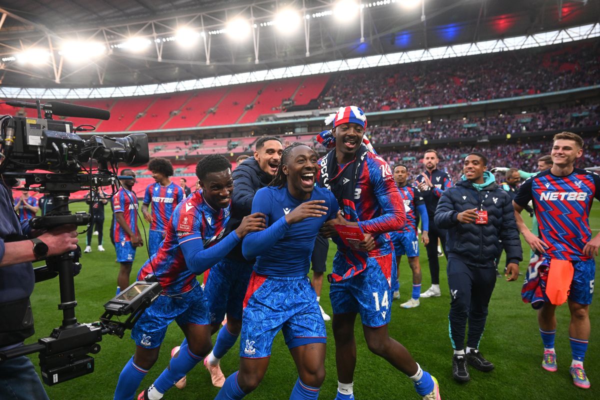 Marc Guehi, Eberechi Eze and Jean-Philippe Mateta of Crystal Palace celebrate victory after the Emirates FA Cup Semi Final match between Crystal Palace and Aston Villa at Wembley Stadium