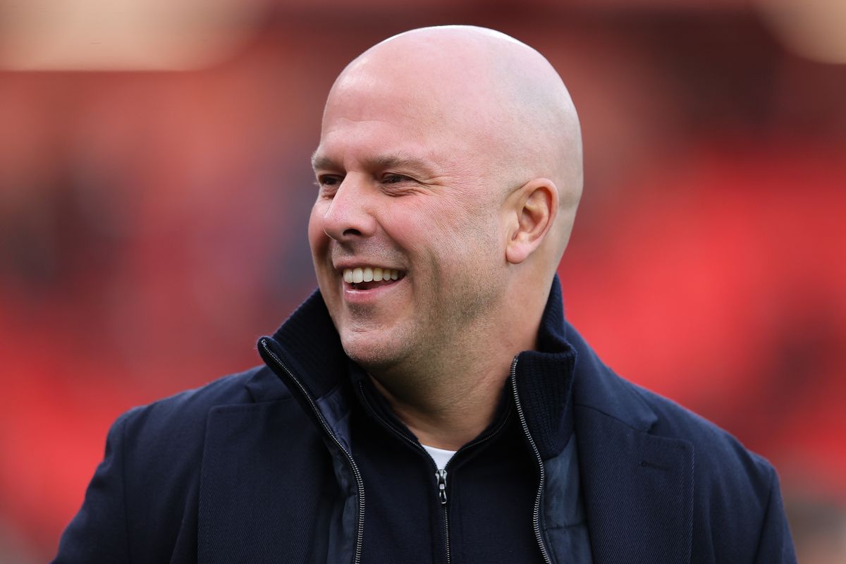 Arne Slot, head coach of Liverpool, smiles