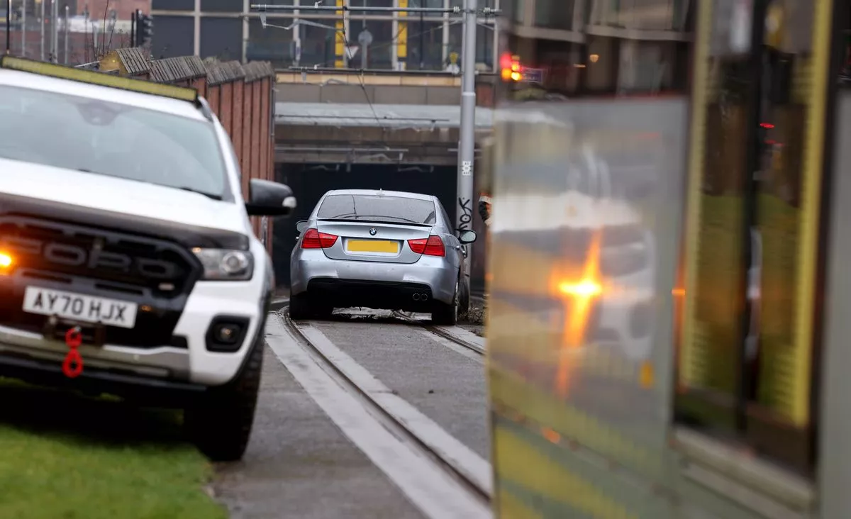 A car on the tram tracks near New Islington tram stop