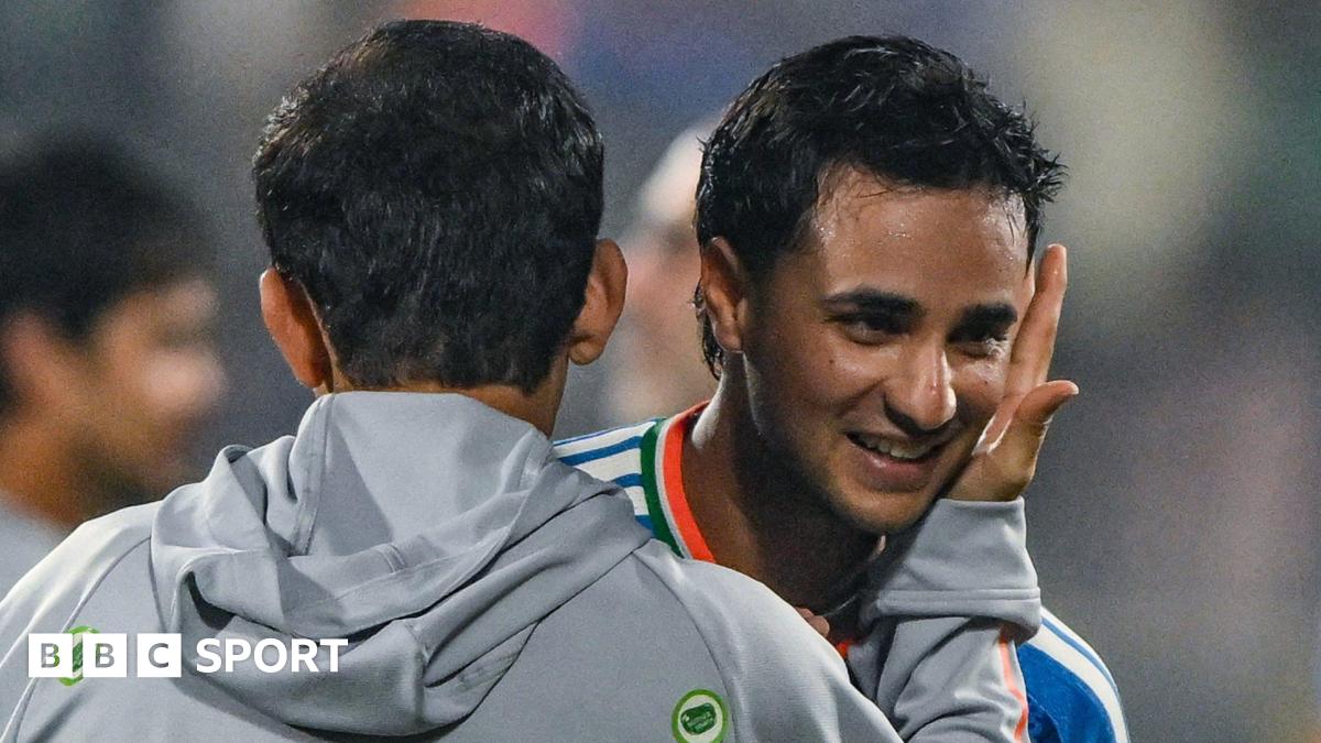 India head coach Gautam Gambhir (left) embraces batter Abhishek Sharma (right) after victory over New Zealand