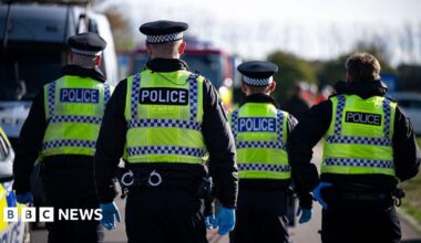 Four police officers search for a missing person during an emergency services test response to chemical incident as part of training exercise