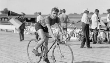 Man cycles bike in black and white photo