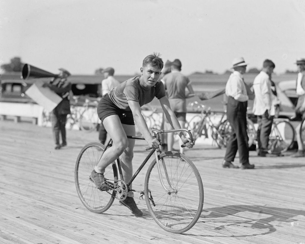 Man cycles bike in black and white photo