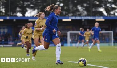 Johanna Rytting Kaneryd, of Chelsea, in action during the Women's FA Cup fourth round match against Crystal Palace. She has blonde hair, tied back, and is looking in front of her as she runs with the ball. Several other players can be seen in the background.