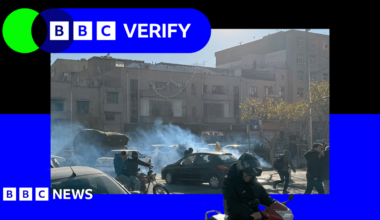 Demonstrators in Iran during anti-government protests. The image is imposed over the BBC Verify branding and colours.