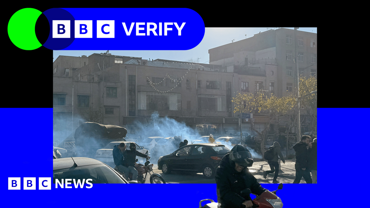 Demonstrators in Iran during anti-government protests. The image is imposed over the BBC Verify branding and colours.