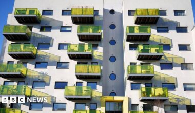 A block of flats in Camberwell, south-east London, with yellow glass balconies.