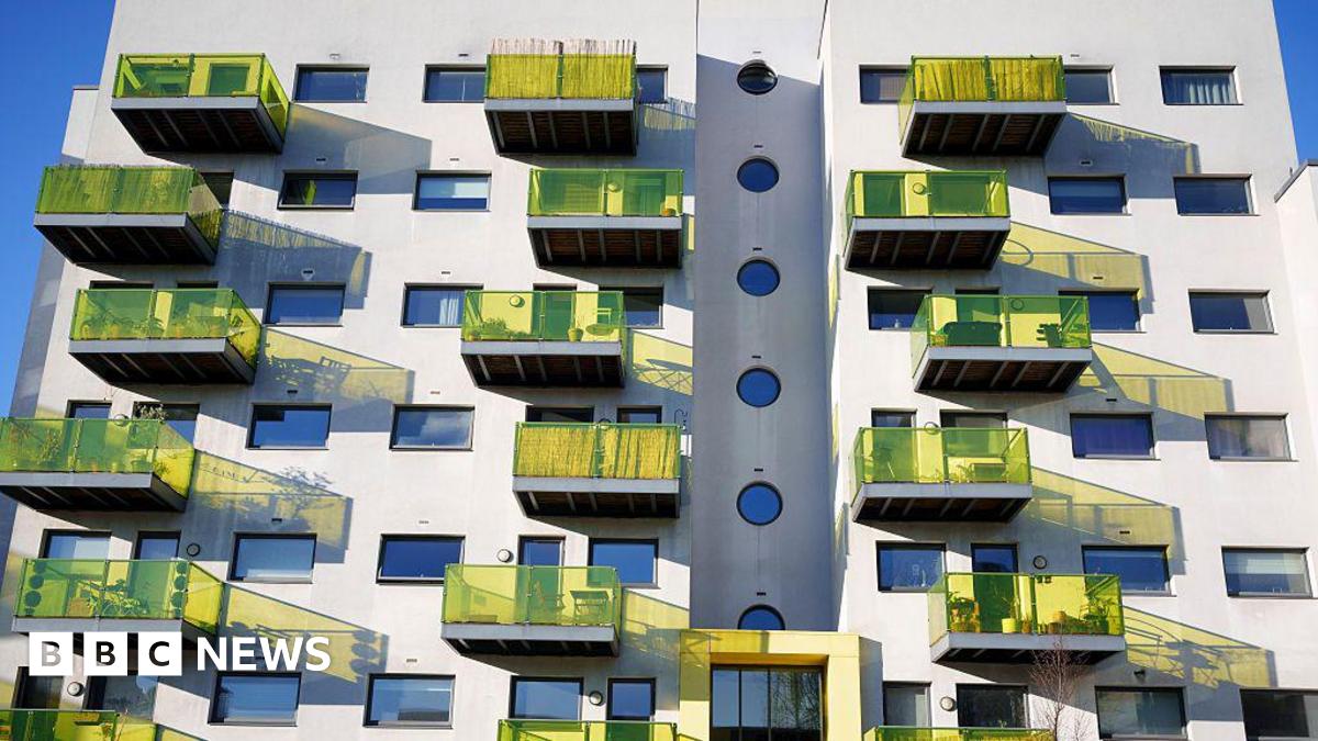 A block of flats in Camberwell, south-east London, with yellow glass balconies.