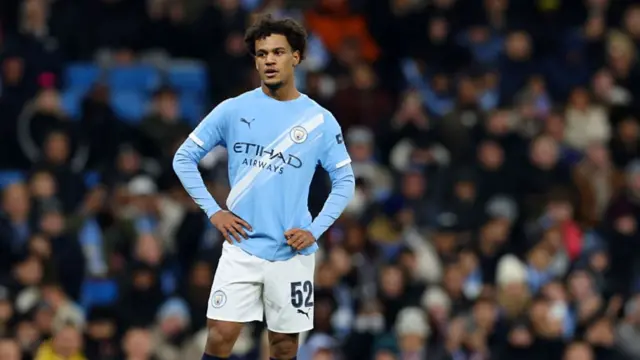 Oscar Bobb in action for Manchester City.