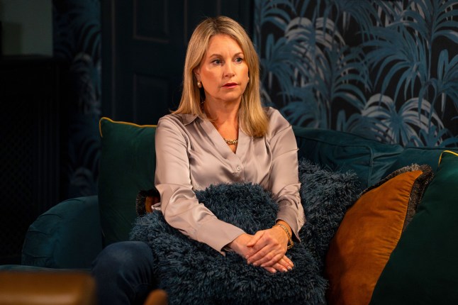 Sam mitchell sat on the couch in EastEnders