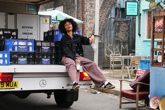 543612,TITLE:Eastenders Indeyarna Donaldson-Holness sat on the bank of a milkfloat as a drunk Jasmine Fisher in EastEnders.